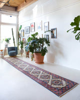 Vintage Turkish runner rug in living room setting, old rug, antique rug, pastel colors, faded colors, Turkish rug, vintage rug, soft rug, Portland, Oregon, rug store, rug shop, local shop