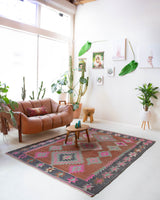 Vintage kilim rug in room decor setting, old rug, antique rug, pastel colors, faded colors, Turkish rug, vintage rug, soft rug, Portland, Oregon, rug store, rug shop, local shop, bold colors, bright colors, faded colors