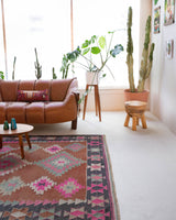 Vintage kilim rug in room decor setting, old rug, antique rug, pastel colors, faded colors, Turkish rug, vintage rug, soft rug, Portland, Oregon, rug store, rug shop, local shop, bold colors, bright colors, faded colors