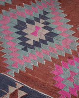 Vintage kilim rug in room decor setting, old rug, antique rug, pastel colors, faded colors, Turkish rug, vintage rug, soft rug, Portland, Oregon, rug store, rug shop, local shop, bold colors, bright colors, faded colors