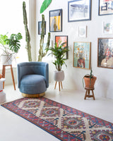 Vintage Turkish runner rug in living room setting, old rug, antique rug, pastel colors, faded colors, Turkish rug, vintage rug, soft rug, Portland, Oregon, rug store, rug shop, local shop