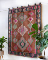 Vintage kilim rug in room decor setting, old rug, antique rug, pastel colors, faded colors, Turkish rug, vintage rug, soft rug, Portland, Oregon, rug store, rug shop, local shop, bold colors, bright colors, faded colors