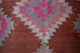 Vintage kilim rug in room decor setting, old rug, antique rug, pastel colors, faded colors, Turkish rug, vintage rug, soft rug, Portland, Oregon, rug store, rug shop, local shop, bold colors, bright colors, faded colors
