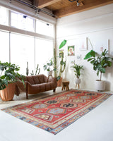 Vintage kilim rug in room decor setting, old rug, antique rug, pastel colors, faded colors, Turkish rug, vintage rug, soft rug, Portland, Oregon, rug store, rug shop, local shop, bold colors, bright colors, faded colors