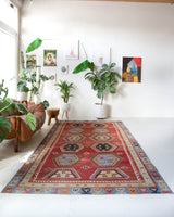 Vintage kilim rug in room decor setting, old rug, antique rug, pastel colors, faded colors, Turkish rug, vintage rug, soft rug, Portland, Oregon, rug store, rug shop, local shop, bold colors, bright colors, faded colors