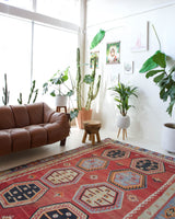 Vintage kilim rug in room decor setting, old rug, antique rug, pastel colors, faded colors, Turkish rug, vintage rug, soft rug, Portland, Oregon, rug store, rug shop, local shop, bold colors, bright colors, faded colors