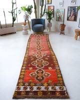 Vintage Turkish runner rug in a living room setting, pile rug, Turkish rug, vintage rug, portland, rug shop, bright colors, wild shaman, soft rug, bold color, Portland, Oregon, rug store, rug shop, local shop, antique rug