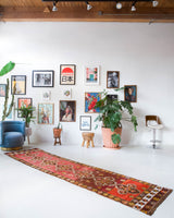 Vintage Turkish runner rug in a living room setting, pile rug, Turkish rug, vintage rug, portland, rug shop, bright colors, wild shaman, soft rug, bold color, Portland, Oregon, rug store, rug shop, local shop, antique rug