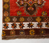 Vintage Turkish runner rug in a living room setting, pile rug, Turkish rug, vintage rug, portland, rug shop, bright colors, wild shaman, soft rug, bold color, Portland, Oregon, rug store, rug shop, local shop, antique rug