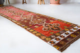 Vintage Turkish runner rug in a living room setting, pile rug, Turkish rug, vintage rug, portland, rug shop, bright colors, wild shaman, soft rug, bold color, Portland, Oregon, rug store, rug shop, local shop, antique rug