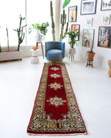 Vintage Turkish runner rug in a living room setting, pile rug, Turkish rug, vintage rug, portland, rug shop, bright colors, wild shaman, soft rug, bold color, Portland, Oregon, rug store, rug shop, local shop, antique rug