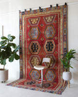 Vintage kilim rug in room decor setting, old rug, antique rug, pastel colors, faded colors, Turkish rug, vintage rug, soft rug, Portland, Oregon, rug store, rug shop, local shop, bold colors, bright colors, faded colors