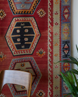 Vintage kilim rug in room decor setting, old rug, antique rug, pastel colors, faded colors, Turkish rug, vintage rug, soft rug, Portland, Oregon, rug store, rug shop, local shop, bold colors, bright colors, faded colors