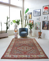 Vintage Turkish rug in living room setting, old rug, antique rug, pastel colors, faded colors, Turkish rug, vintage rug, soft rug, Portland, Oregon, rug store, rug shop, local shop