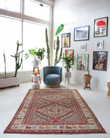 Vintage Turkish rug in living room setting, old rug, antique rug, pastel colors, faded colors, Turkish rug, vintage rug, soft rug, Portland, Oregon, rug store, rug shop, local shop