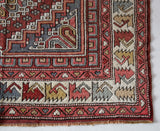 Vintage Turkish rug in living room setting, old rug, antique rug, pastel colors, faded colors, Turkish rug, vintage rug, soft rug, Portland, Oregon, rug store, rug shop, local shop