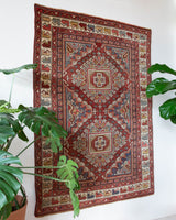 Vintage Turkish rug in living room setting, old rug, antique rug, pastel colors, faded colors, Turkish rug, vintage rug, soft rug, Portland, Oregon, rug store, rug shop, local shop