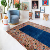 Vintage Turkish rug in a living room setting, pile rug, Turkish rug, vintage rug, portland, rug shop, bright colors, wild shaman, soft rug, bold color, Portland, Oregon, rug store, rug shop, local shop, antique rug