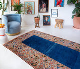 Vintage Turkish rug in a living room setting, pile rug, Turkish rug, vintage rug, portland, rug shop, bright colors, wild shaman, soft rug, bold color, Portland, Oregon, rug store, rug shop, local shop, antique rug
