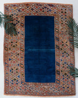 Vintage Turkish rug in a living room setting, pile rug, Turkish rug, vintage rug, portland, rug shop, bright colors, wild shaman, soft rug, bold color, Portland, Oregon, rug store, rug shop, local shop, antique rug