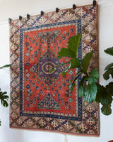 Vintage Turkish rug in living room setting, old rug, antique rug, pastel colors, faded colors, Turkish rug, vintage rug, soft rug, Portland, Oregon, rug store, rug shop, local shop