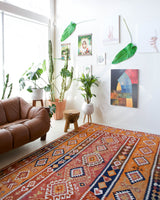 Vintage kilim rug in room decor setting, old rug, antique rug, pastel colors, faded colors, Turkish rug, vintage rug, soft rug, Portland, Oregon, rug store, rug shop, local shop, bold colors, bright colors, faded colors