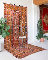 Vintage kilim rug in room decor setting, old rug, antique rug, pastel colors, faded colors, Turkish rug, vintage rug, soft rug, Portland, Oregon, rug store, rug shop, local shop, bold colors, bright colors, faded colors