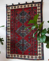 Vintage Turkish rug in a living room setting, pile rug, Turkish rug, vintage rug, portland, rug shop, bright colors, wild shaman, soft rug, bold color, Portland, Oregon, rug store, rug shop, local shop, antique rug