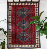 Vintage Turkish rug in a living room setting, pile rug, Turkish rug, vintage rug, portland, rug shop, bright colors, wild shaman, soft rug, bold color, Portland, Oregon, rug store, rug shop, local shop, antique rug