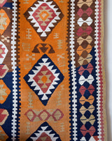 Vintage kilim rug in room decor setting, old rug, antique rug, pastel colors, faded colors, Turkish rug, vintage rug, soft rug, Portland, Oregon, rug store, rug shop, local shop, bold colors, bright colors, faded colors