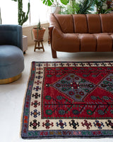 Vintage Turkish rug in a living room setting, pile rug, Turkish rug, vintage rug, portland, rug shop, bright colors, wild shaman, soft rug, bold color, Portland, Oregon, rug store, rug shop, local shop, antique rug