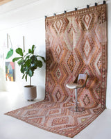 Vintage kilim rug in living room setting, old rug, antique rug, pastel colors, faded colors, Turkish rug, vintage rug, soft rug, Portland, Oregon, rug store, rug shop, local shop, earthy tones, earthy colors, warm colors