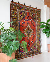 Vintage Turkish rug in a living room setting, pile rug, Turkish rug, vintage rug, portland, rug shop, bright colors, wild shaman, soft rug, bold color, Portland, Oregon, rug store, rug shop, local shop, antique rug
