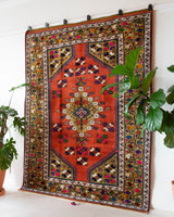 Vintage Turkish rug in a living room setting, pile rug, Turkish rug, vintage rug, portland, rug shop, bright colors, wild shaman, soft rug, bold color, Portland, Oregon, rug store, rug shop, local shop, antique rug
