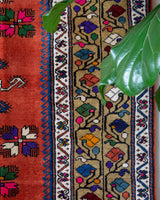 Vintage Turkish rug in a living room setting, pile rug, Turkish rug, vintage rug, portland, rug shop, bright colors, wild shaman, soft rug, bold color, Portland, Oregon, rug store, rug shop, local shop, antique rug