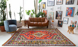 Vintage Turkish rug in a living room setting, pile rug, Turkish rug, vintage rug, portland, rug shop, bright colors, wild shaman, soft rug, bold color, Portland, Oregon, rug store, rug shop, local shop, antique rug