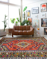 Vintage Turkish rug in a living room setting, pile rug, Turkish rug, vintage rug, portland, rug shop, bright colors, wild shaman, soft rug, bold color, Portland, Oregon, rug store, rug shop, local shop, antique rug