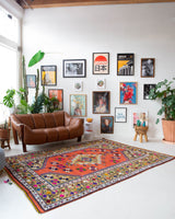 Vintage Turkish rug in a living room setting, pile rug, Turkish rug, vintage rug, portland, rug shop, bright colors, wild shaman, soft rug, bold color, Portland, Oregon, rug store, rug shop, local shop, antique rug