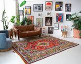 Vintage Turkish rug in a living room setting, pile rug, Turkish rug, vintage rug, portland, rug shop, bright colors, wild shaman, soft rug, bold color, Portland, Oregon, rug store, rug shop, local shop, antique rug