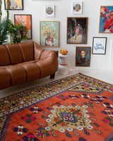 Vintage Turkish rug in a living room setting, pile rug, Turkish rug, vintage rug, portland, rug shop, bright colors, wild shaman, soft rug, bold color, Portland, Oregon, rug store, rug shop, local shop, antique rug