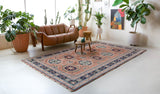 Vintage Turkish rug in a living room setting, pile rug, Turkish rug, vintage rug, portland, rug shop, bright colors, wild shaman, soft rug, bold color, Portland, Oregon, rug store, rug shop, local shop,