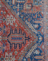 Antique Persian area rug in a living room setting, pile rug, vintage rug, portland, rug shop, bright colors, wild shaman, soft rug, bold color, Portland, Oregon, rug store, rug shop, local shop, antique rug, Persian rug, handmade rug, wool rug, distressed rug