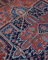 Antique Persian area rug in a living room setting, pile rug, vintage rug, portland, rug shop, bright colors, wild shaman, soft rug, bold color, Portland, Oregon, rug store, rug shop, local shop, antique rug, Persian rug, handmade rug, wool rug, distressed rug