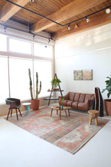 Vintage kilim rug in room decor setting, old rug, antique rug, pastel colors, faded colors, Turkish rug, vintage rug, soft rug, Portland, Oregon, rug store, rug shop, local shop, distressed rug, worn out rug