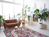Vintage Turkish rug in a living room setting, pile rug, Turkish rug, vintage rug, portland, rug shop, bright colors, wild shaman, soft rug, bold color, Portland, Oregon, rug store, rug shop, local shop