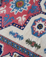 Vintage Turkish rug in a living room setting, pile rug, Turkish rug, vintage rug, portland, rug shop, bright colors, wild shaman, soft rug, bold color, Portland, Oregon, rug store, rug shop, local shop