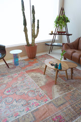 Vintage kilim rug in room decor setting, old rug, antique rug, pastel colors, faded colors, Turkish rug, vintage rug, soft rug, Portland, Oregon, rug store, rug shop, local shop, distressed rug, worn out rug