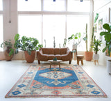 Vintage Turkish rug in living room setting, old rug, antique rug, pastel colors, faded colors, Turkish rug, vintage rug, soft rug, Portland, Oregon, rug store, rug shop, local shop