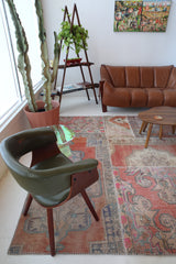 Vintage kilim rug in room decor setting, old rug, antique rug, pastel colors, faded colors, Turkish rug, vintage rug, soft rug, Portland, Oregon, rug store, rug shop, local shop, distressed rug, worn out rug