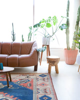 Vintage Turkish rug in living room setting, old rug, antique rug, pastel colors, faded colors, Turkish rug, vintage rug, soft rug, Portland, Oregon, rug store, rug shop, local shop